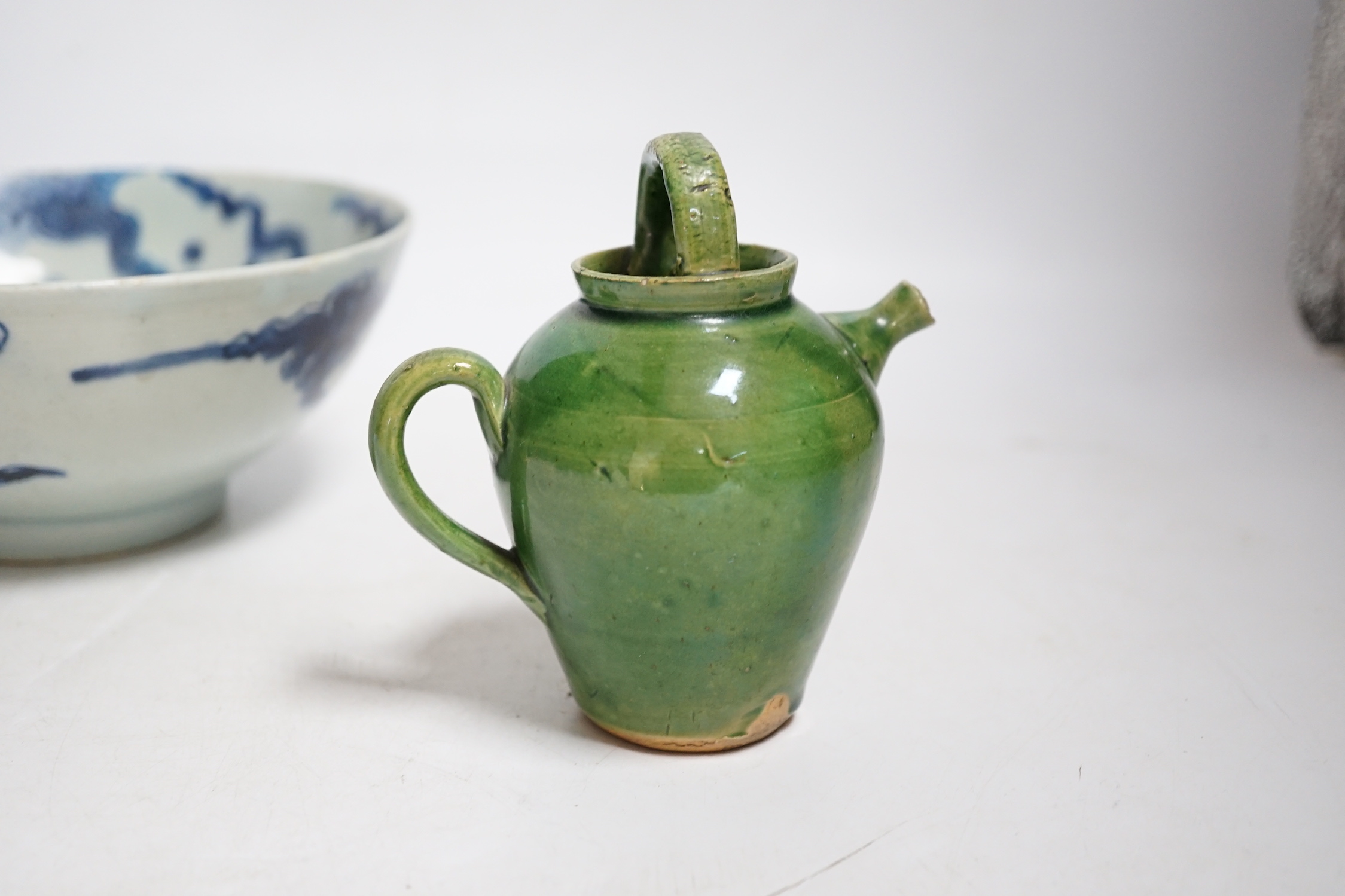 A Chinese blue and white ‘dragon’ bowl and a green glazed water pot, bowl 17.5cm diameter